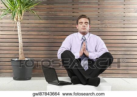 Businessman practicing yoga View Large Photo Image Picture - Businessman practicing yoga. Fotosearch