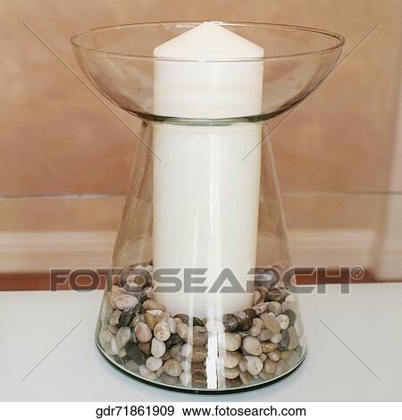 Stock Photo - Candle on a table. Fotosearch