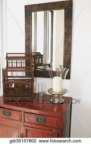 Candle stand with a showpiece on a sideboard View Large Photo Image Stock Image - Candle stand with a showpiece on a sideboard. Fotosearch