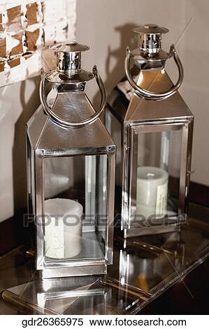 Stock Photography - Candles in candle stands. Fotosearch