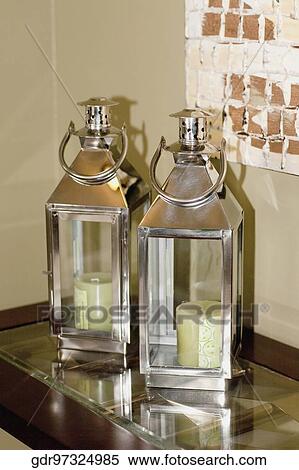 Stock Photography - Candles in candle stands. Fotosearch