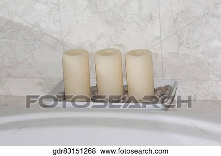 Candles on a bathroom sink View Large Photo Image Stock Photo - Candles on a bathroom sink. Fotosearch
