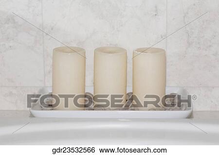 Candles on a bathroom sink View Large Photo Image Stock Photograph - Candles on a bathroom sink. Fotosearch