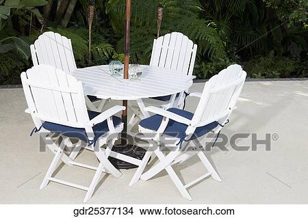 Chairs around a table View Large Photo Image Picture - Chairs around a table. Fotosearch