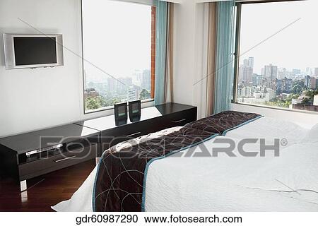 City viewed through the window of a bedroom View Large Photo Image Stock Image - City viewed through the window of a bedroom. Fotosearch