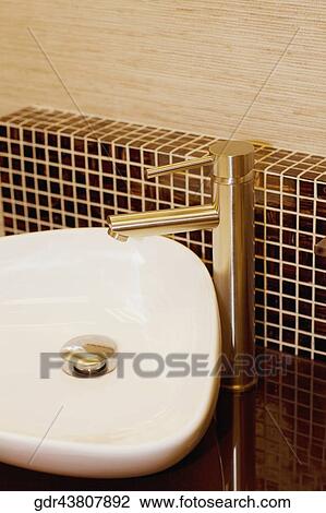 Stock Image - Close-up of a bathroom sink. Fotosearch