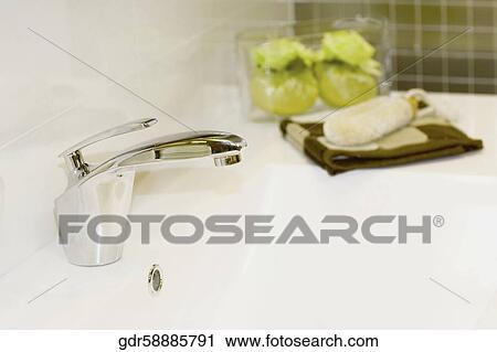 Stock Image - Close-up of a bathroom sink. Fotosearch