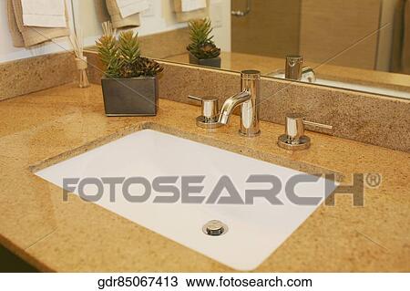 Stock Image - Close-up of a bathroom sink. Fotosearch