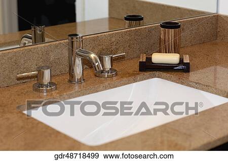 Stock Photo - Close-up of a bathroom sink. Fotosearch