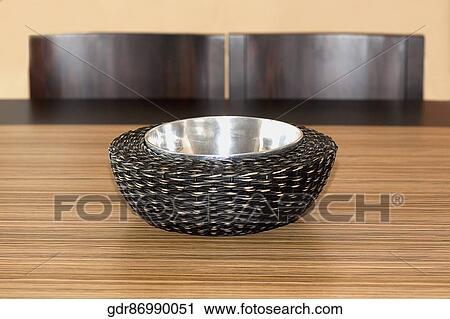 Close-up of a bowl on a dining table View Large Photo Image Stock Image - Close-up of a bowl on a dining table. Fotosearch