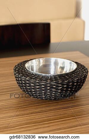 Stock Photograph - Close-up of a bowl on a dining table. Fotosearch