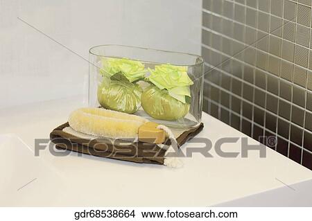 Picture - Close-up of a brush with herbs in the bathroom. Fotosearch