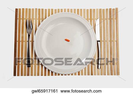Close-up of a capsule on a plate View Large Photo Image Stock Image - Close-up of a capsule on a plate. Fotosearch