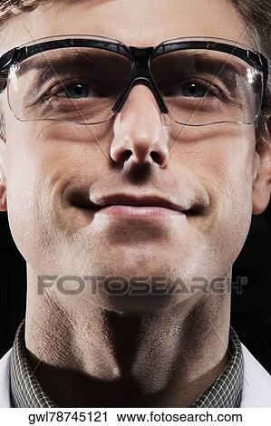 Close-up of a doctor smiling View Large Photo Image Stock Image - Close-up of a doctor smiling. Fotosearch