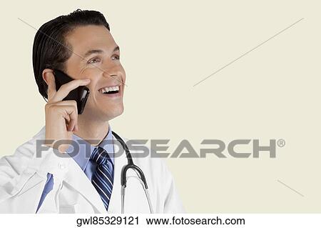 Close-up of a doctor talking on a mobile phone View Large Photo Image Stock Image - Close-up of a doctor talking on a mobile phone. Fotosearch
