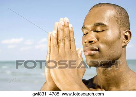 Stock Photography - Close-up of a man meditating. Fotosearch