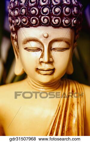 Close-up of a statue of Buddha View Large Photo Image Stock Photo - Close-up of a statue of Buddha. Fotosearch