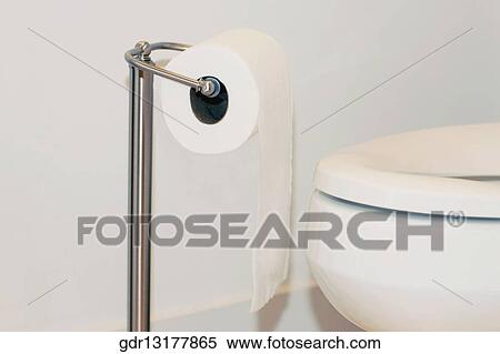 Close-up of a toilet roll with a toilet bowl View Large Photo Image Stock Photography - Close-up of a toilet roll with a toilet bowl. Fotosearch