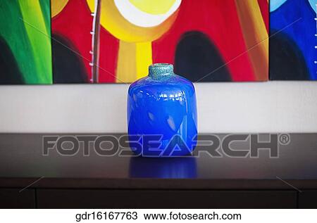 Close-up of a vase on a sideboard View Large Photo Image Stock Image - Close-up of a vase on a sideboard. Fotosearch
