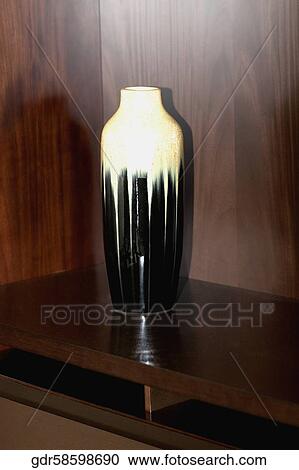 Stock Image - Close-up of a vase on a sideboard. Fotosearch