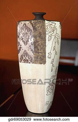 Close-up of a vase on a sideboard View Large Photo Image Stock Photo - Close-up of a vase on a sideboard. Fotosearch