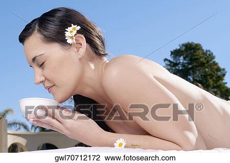 Close-up of a woman smelling a bowl View Large Photo Image Stock Image - Close-up of a woman smelling a bowl. Fotosearch