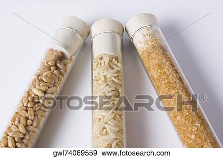 Close-up of brown rice and sugar with wheat in test tubes View Large Photo Image Stock Photo - Close-up of brown rice and sugar with wheat in test tubes. Fotosearch