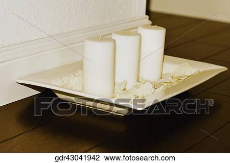 Close-up of candles on a tray View Large Photo Image Stock Image - Close-up of candles on a tray. Fotosearch