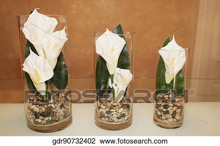 Stock Image - Close-up of flower vases on a sideboard. Fotosearch