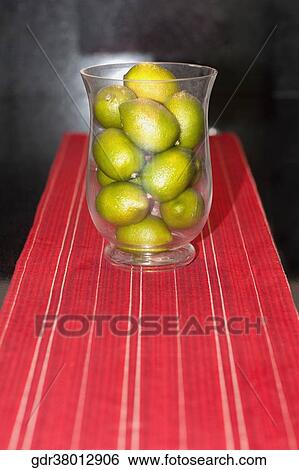 Close-up of lemons in a glass View Large Photo Image Stock Photograph - Close-up of lemons in a glass. Fotosearch