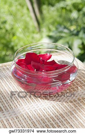 Picture - Close-up of rose petals in a bowl. Fotosearch