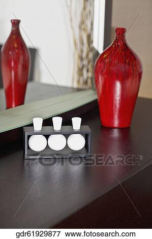 Close-up of showpieces on a sideboard View Large Photo Image Stock Photo - Close-up of showpieces on a sideboard. Fotosearch