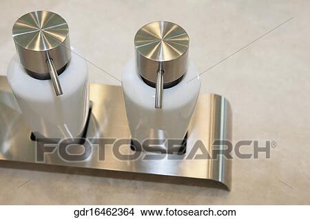 Close-up of soap dispensers View Large Photo Image Picture - Close-up of soap dispensers. Fotosearch