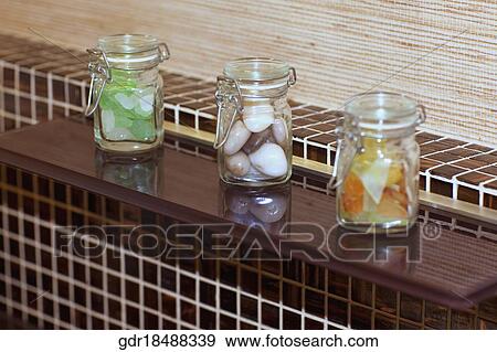 Close-up of three jars in the bathroom View Large Photo Image Stock Photo - Close-up of three jars in the bathroom. Fotosearch