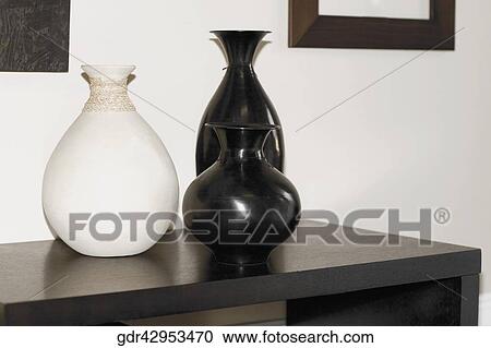 Stock Image - Close-up of vases on a sideboard. Fotosearch