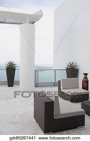 Couch in the balcony of a house View Large Photo Image Stock Image - Couch in the balcony of a house. Fotosearch
