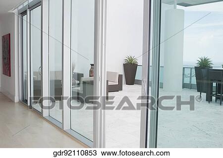 Stock Image - Couch in the balcony of a house. Fotosearch