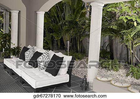 Couch on the porch of a house View Large Photo Image Stock Image - Couch on the porch of a house. Fotosearch