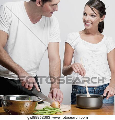 Couple cooking together View Large Photo Image Stock Image - Couple cooking together. Fotosearch