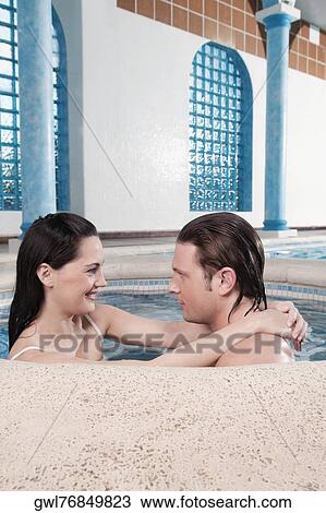 Couple romancing in a hot tub View Large Photo Image Stock Image - Couple romancing in a hot tub. Fotosearch