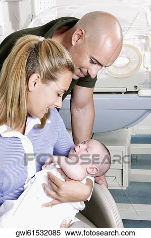 Couple with their newborn baby View Large Photo Image Stock Photography - Couple with their newborn baby. Fotosearch