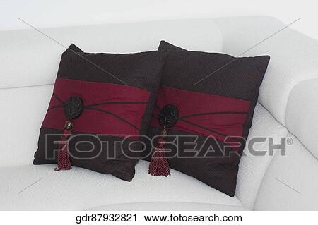 Stock Image - Cushions on a couch in a living room. Fotosearch