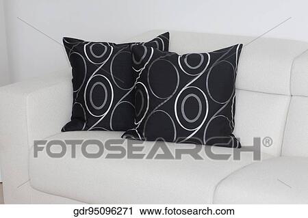 Stock Image - Cushions on a couch in a living room. Fotosearch