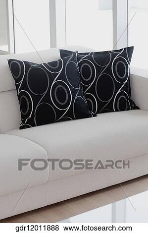 Cushions on a couch in a living room View Large Photo Image Stock Photo - Cushions on a couch in a living room. Fotosearch