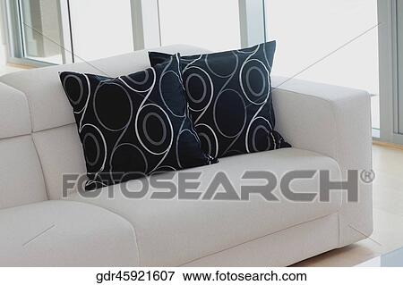 Cushions on a couch in a living room View Large Photo Image Stock Photo - Cushions on a couch in a living room. Fotosearch