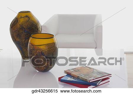 Decorative urns and magazines on a table View Large Photo Image Stock Photography - Decorative urns and magazines on a table. Fotosearch