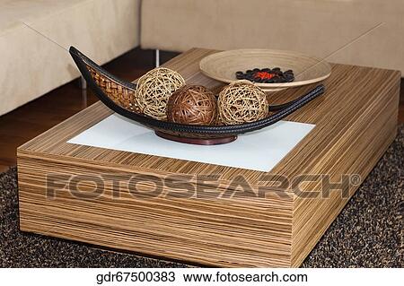 Decorative wicker balls and pebbles on a wooden plate on a table View Large Photo Image Stock Image - Decorative wicker balls and pebbles on a wooden plate on a table. Fotosearch