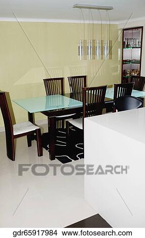 Dining table and chairs in a dining room View Large Photo Image Picture - Dining table and chairs in a dining room. Fotosearch