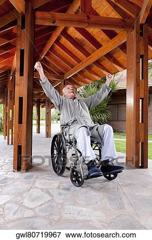 Stock Photo - Disabled man sitting in a wheelchair. Fotosearch