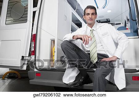 Doctor sitting in an ambulance View Large Photo Image Stock Image - Doctor sitting in an ambulance. Fotosearch